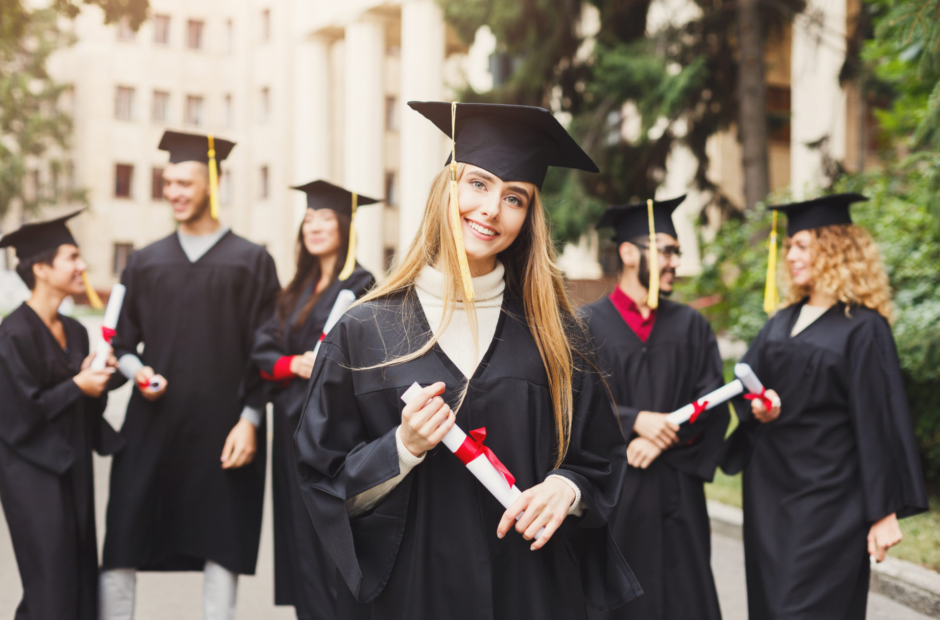 Female graduate holding her diploma