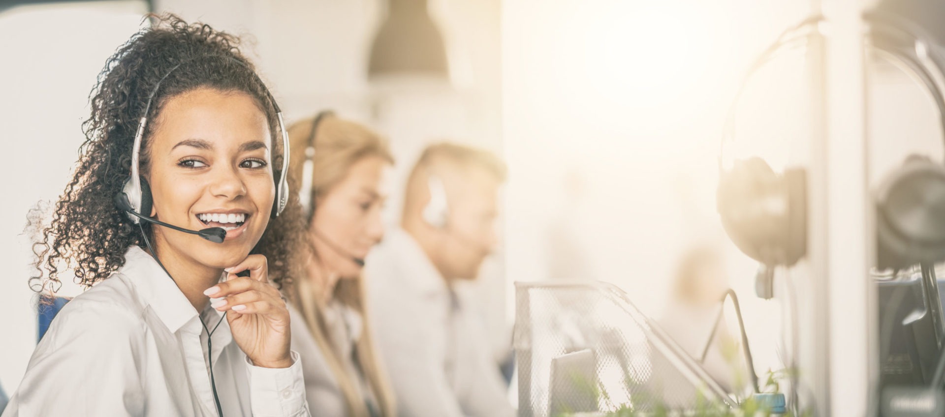 Female call center employee talking on her headset