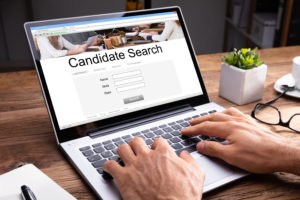 "Candidate Search" website on an applicant tracking system shown on laptop