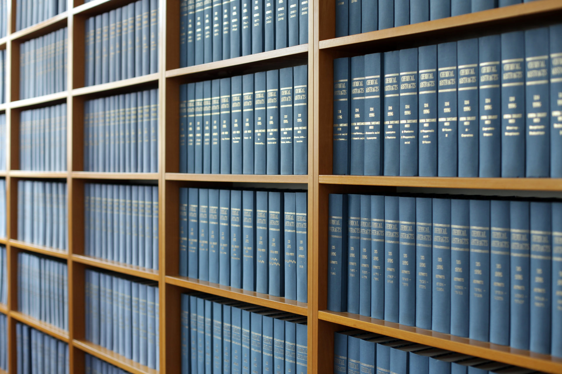 Bookshelf filled with blue legal books