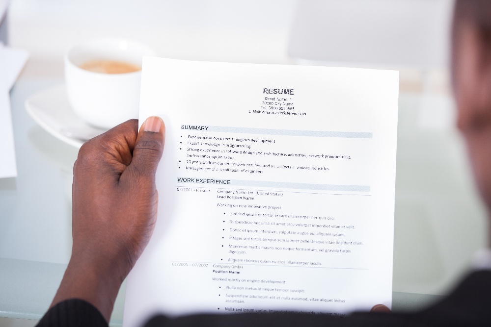 Professional holding a resume