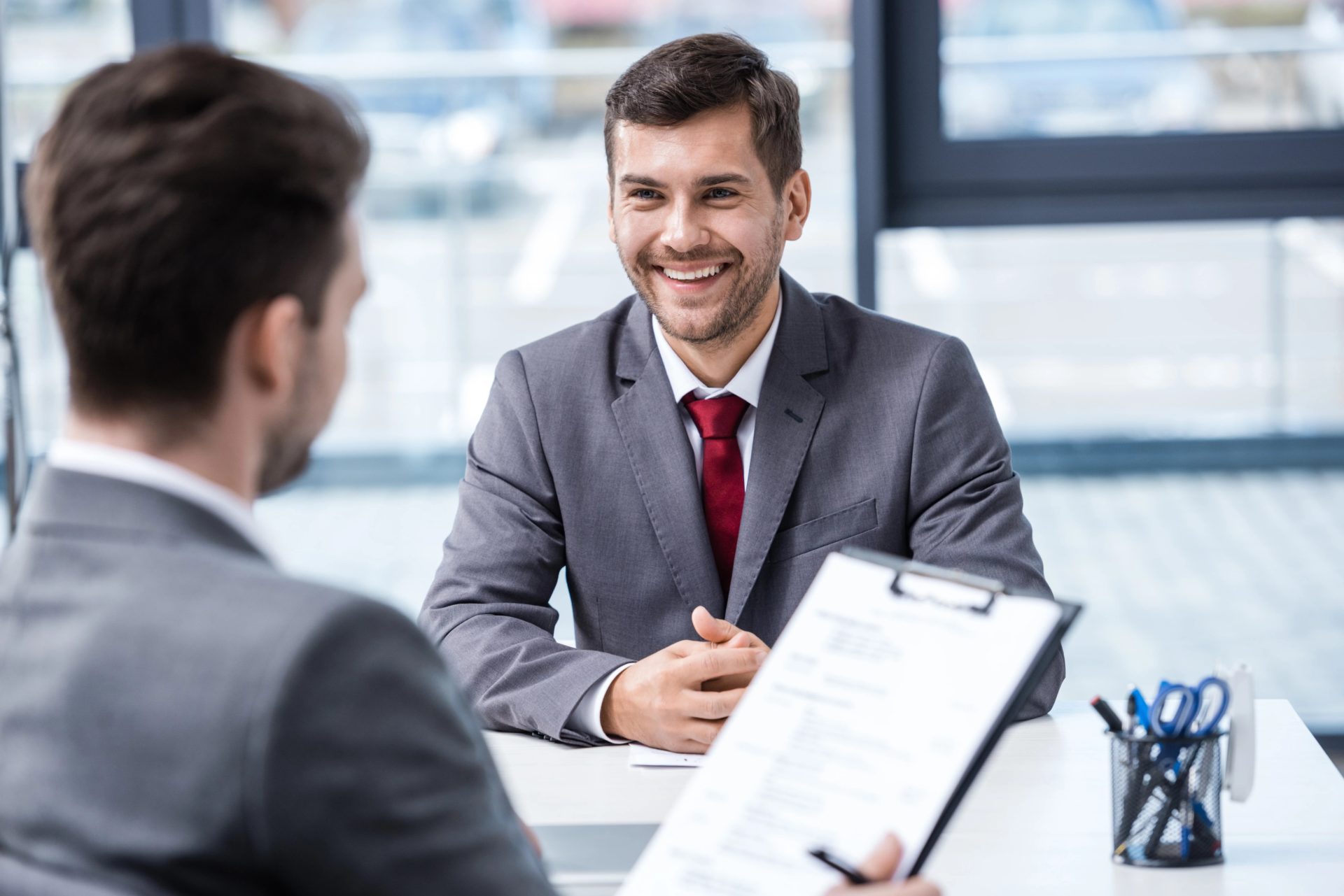 Two male professionals talking during an interview