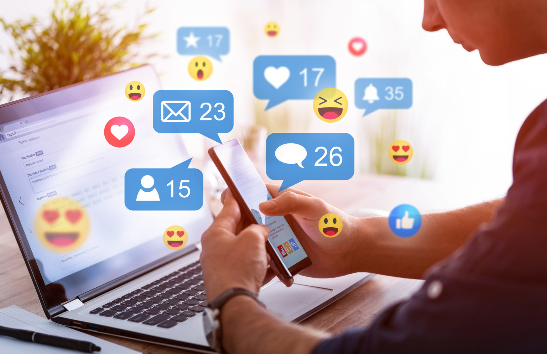 Hands holding smartphone with social media network icons