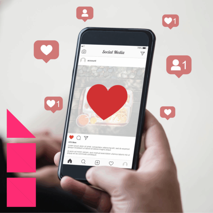 A recruiter holding a smartphone displaying an Instagram-style post with a large red heart over the image. Several red notification icons float around the phone, showing likes and new followers.