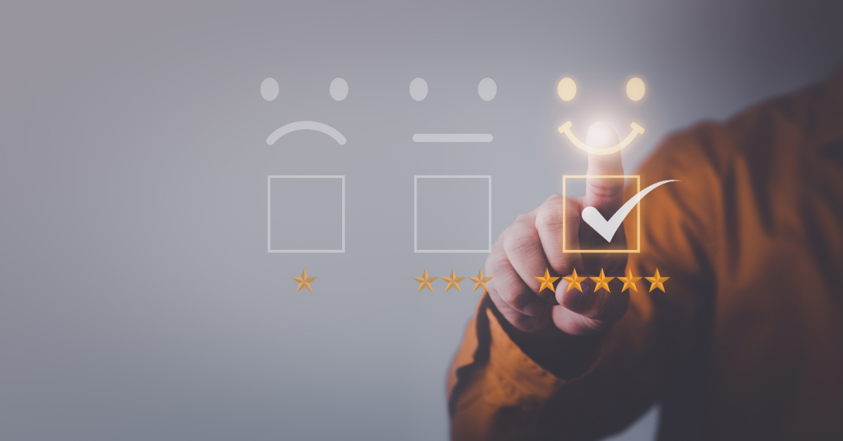 Man checking of a box underneath a smiley face and above five gold stars