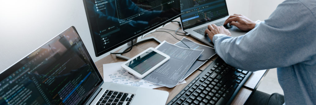 Programmer Typing Code on desktop computer, Developing programming and coding technologies