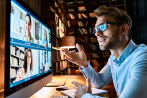 Hiring manager talking with diverse professionals in virtual video interview