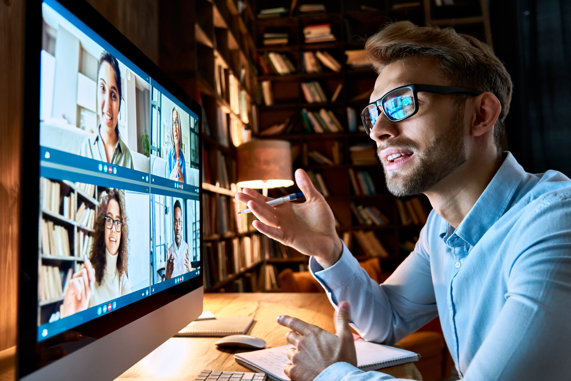 Hiring manager talking with diverse professionals in virtual video interview