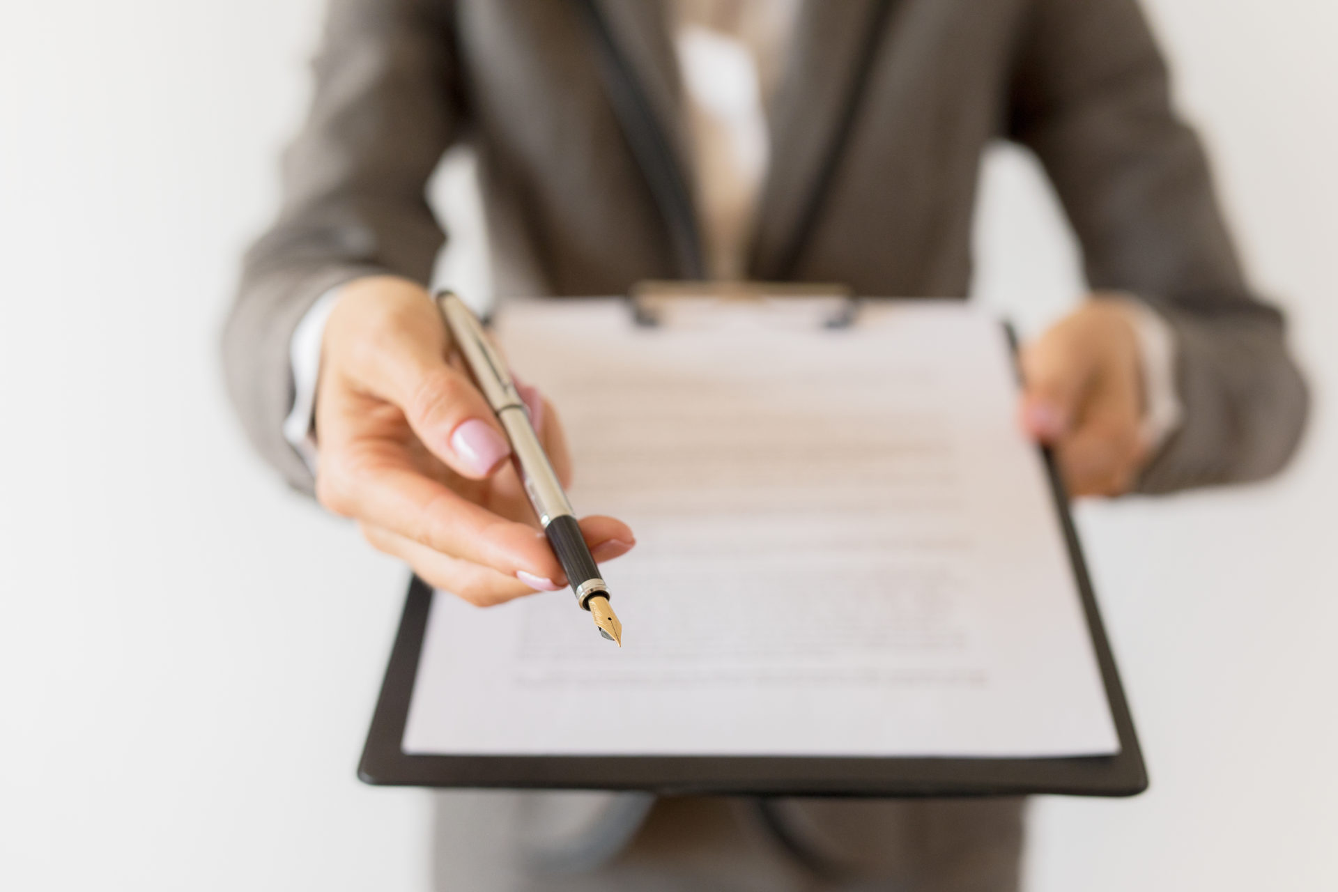Woman holding ready to sign counteroffer and pen