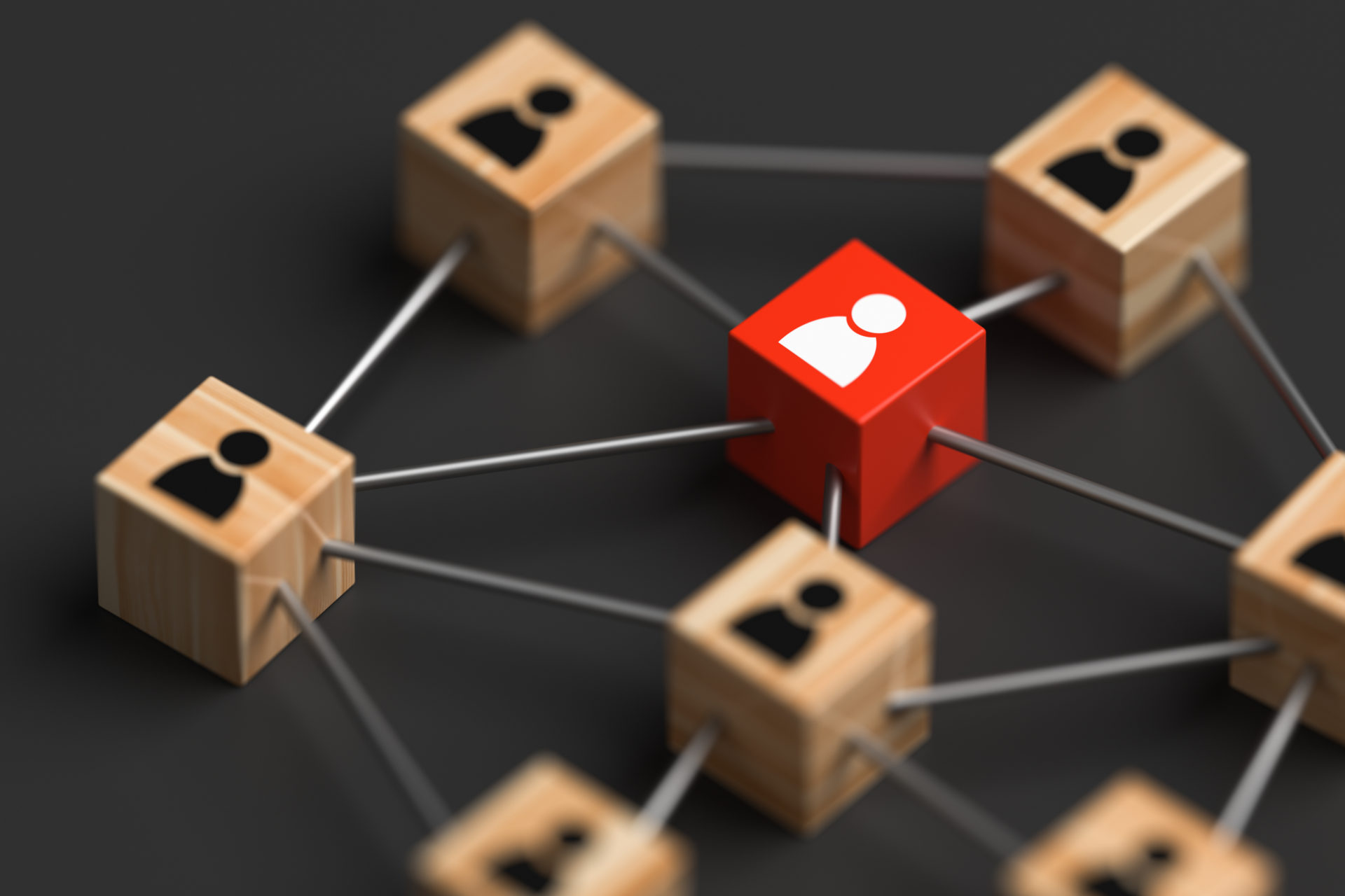 Wooden blocks connecting with a people icon on a gray background selective focus. Talent pipeline concept.
