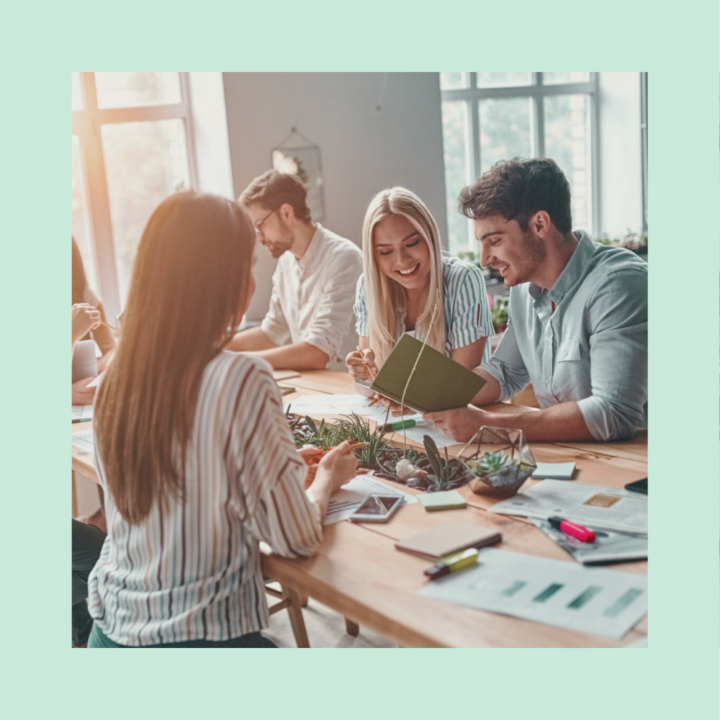 Group of young business people are working together in modern office for a startup. Creative people with laptop, tablet, smart phone, notebook.
