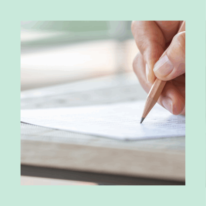 Professional using a pencil to take a pre-employment assessment