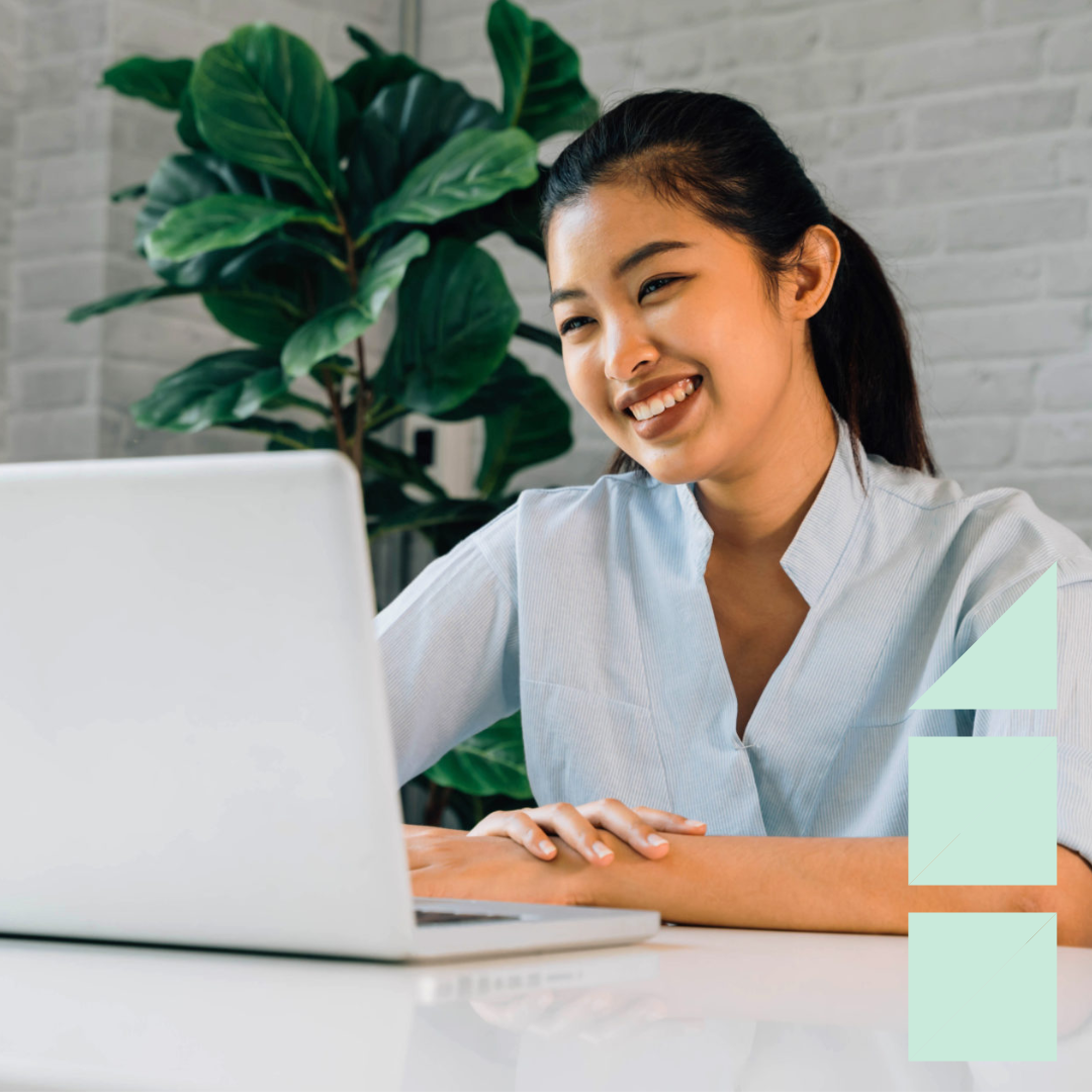Happy friendly woman using a laptop and talking, making video call conference, online job interview at home.