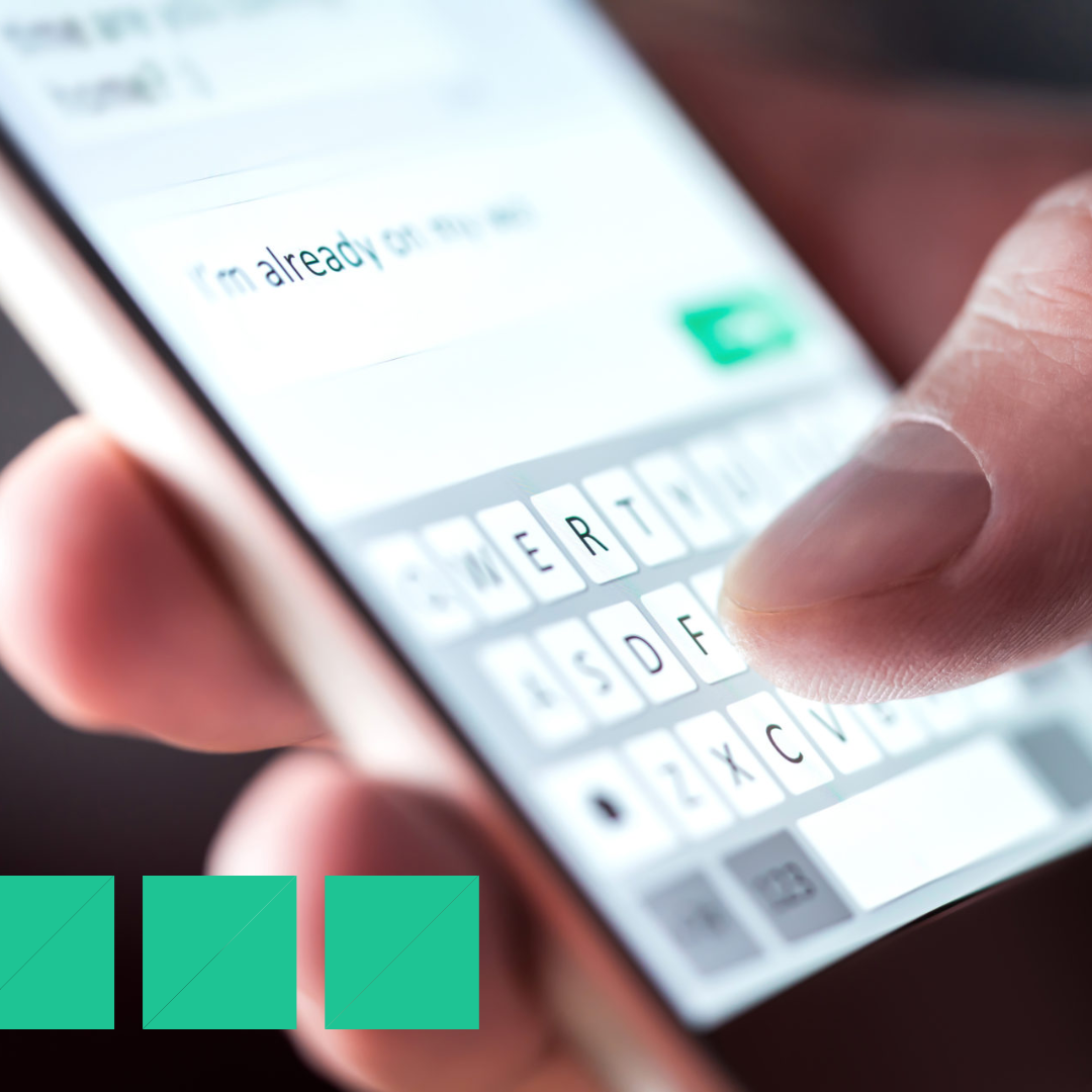 Man sending text message and sms with smartphone.