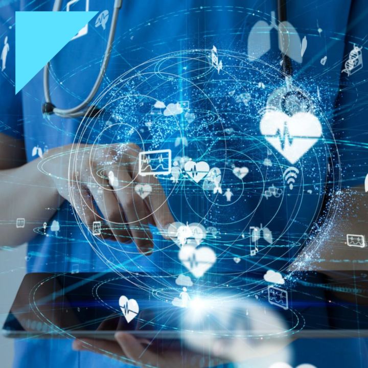 Healthcare professional using digital recruitment technology, with virtual healthcare data, heart icons, and connected medical analytics displayed over a tablet screen.