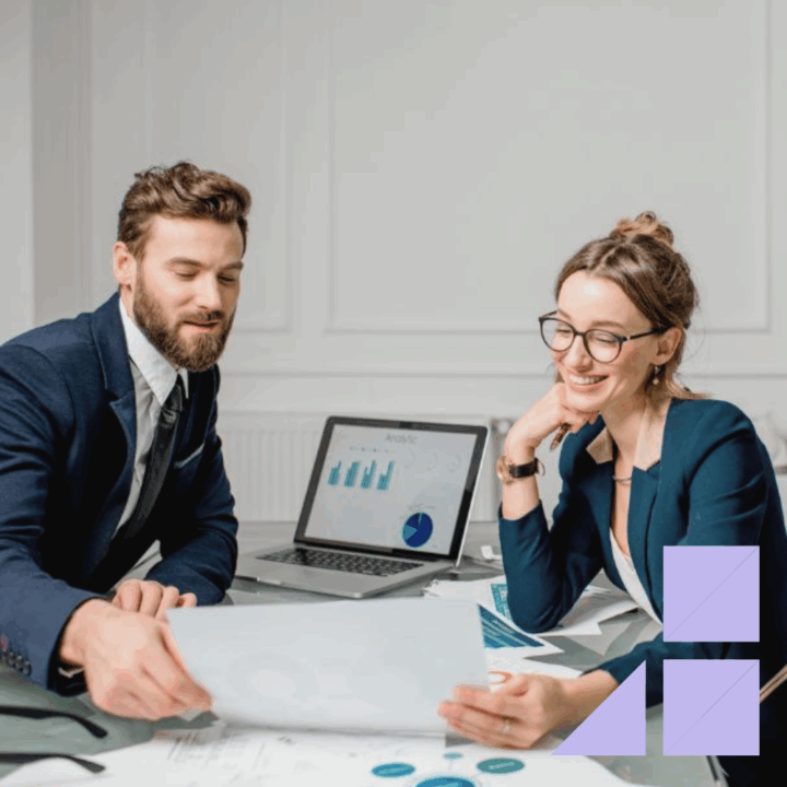 Female job finance candidate talking to male hiring manager showing examples of her work and resume