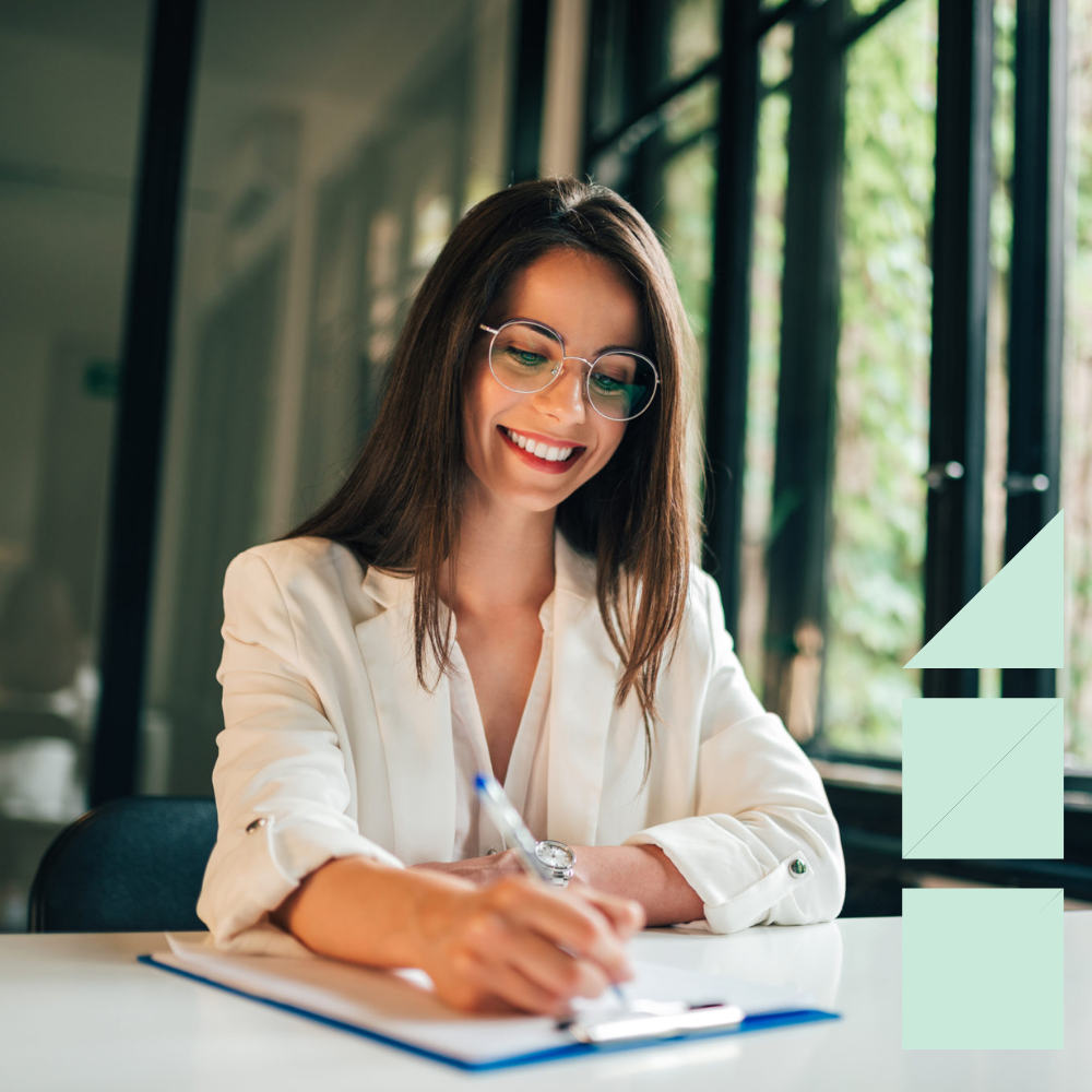 Female marketing hiring manager writing down notes during an interview.