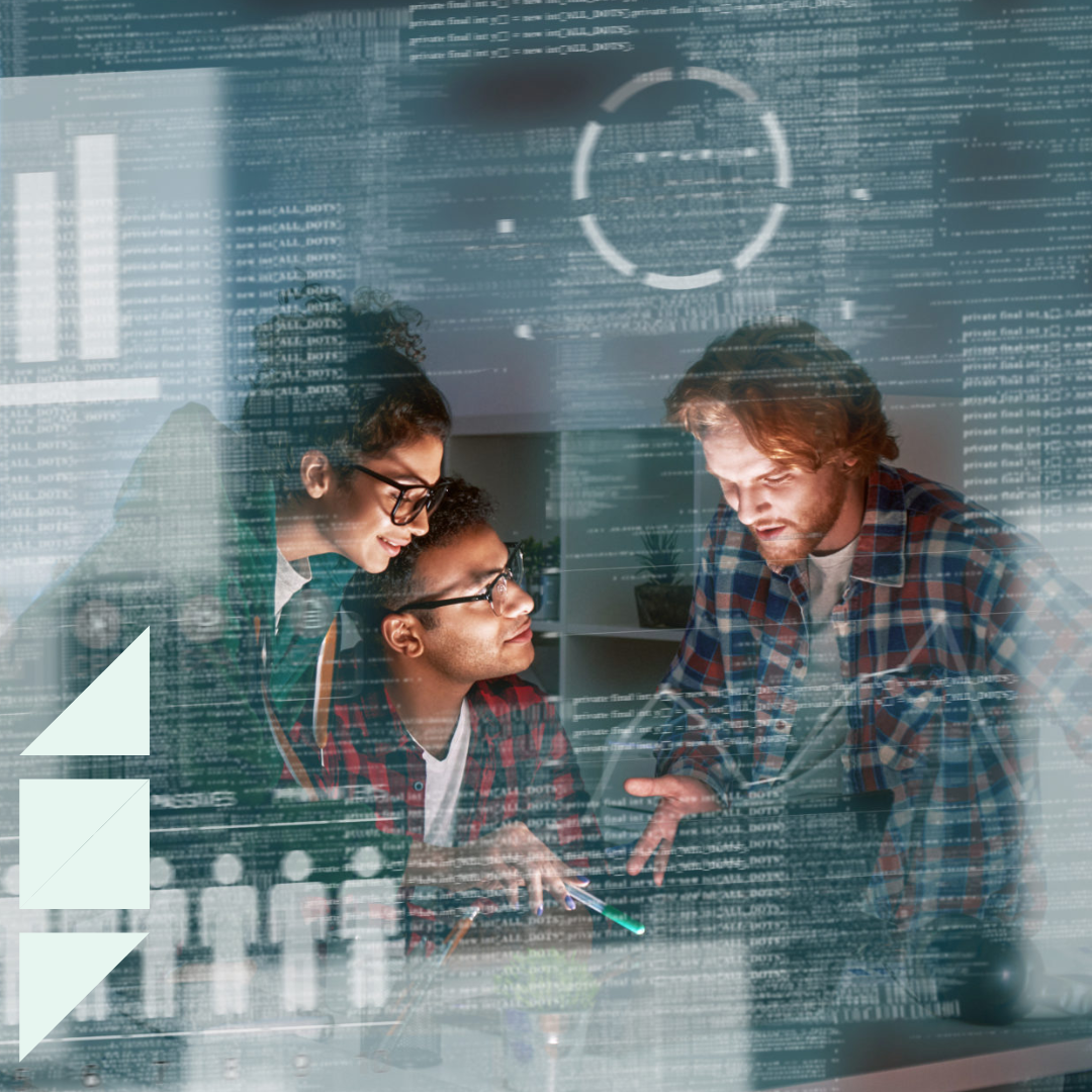 Three IT professionals collaborating on a software project, reviewing code and data on a laptop with digital interface overlays and analytics graphics visible.