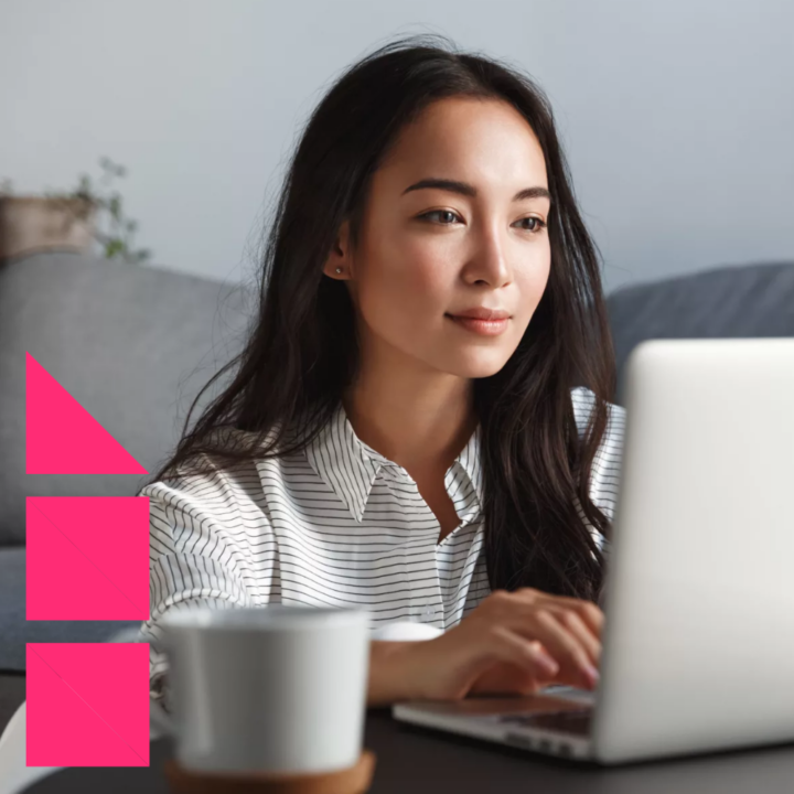 Young ambitious business woman sitting on floor on her laptop in her home writing an email to her interviewer after being rejected