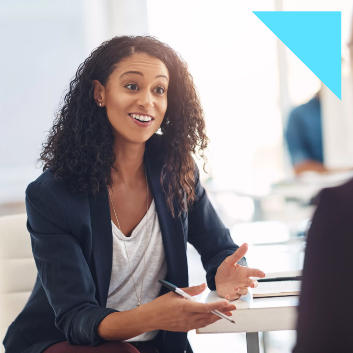 Interview with a happy, excited and confident employer talking to a shortlist candidate for a job. Candidate is asking unique interview questions.