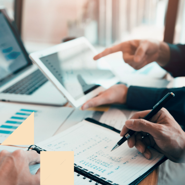 HR professionals writing cost work progress and using a tablet to analysis graph company recruiting budget report and planning for future hiring.