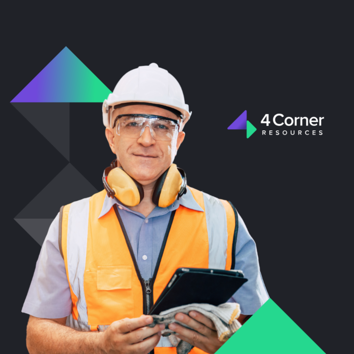 Male professional in hard hat holding tablet smiling next to 4 corner resources logo