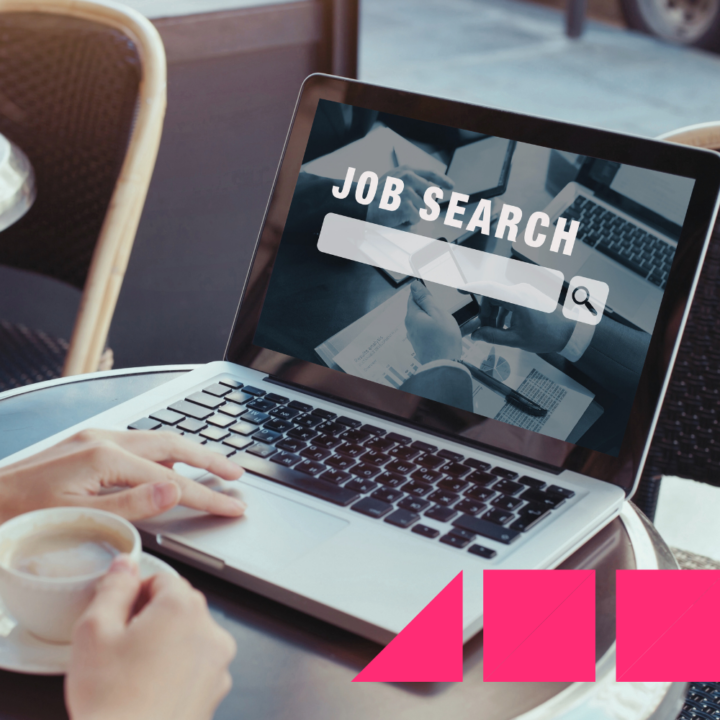 Woman on her laptop with a cup of coffee looking online at different job opportunities