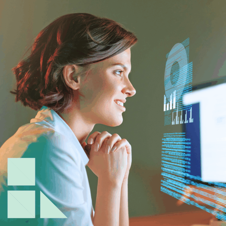 Female tech professional reviews digital analytics on a computer screen, symbolizing the growing demand for skilled talent in today’s competitive tech hiring market.