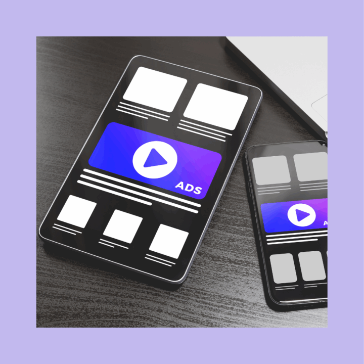 Tablet and smartphone displaying digital advertisements with a large "ADS" play button graphic on screen, symbolizing online recruitment advertising strategies.