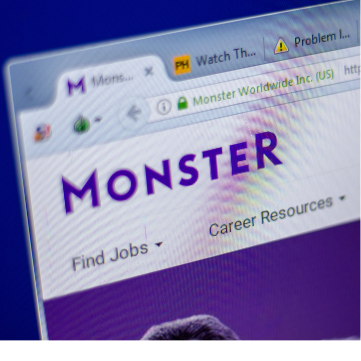 A close-up of a computer screen displaying the Monster job search website, with the Monster logo and navigation links such as “Find Jobs” and “Career Resources” visible at the top.