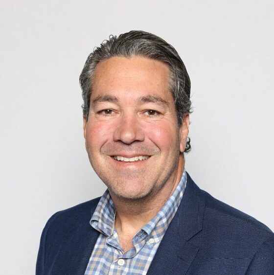 A closeup of Pete Newsome, looking into the camera and smiling.