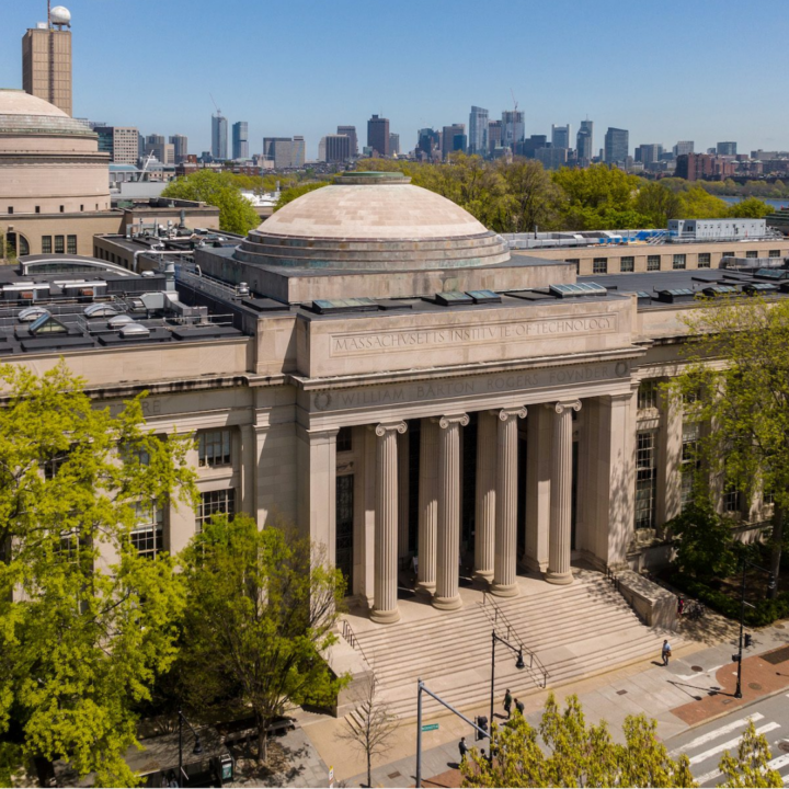 Exterior of the Massachusetts Institute of Technology’s main campus building in Cambridge, featuring its iconic dome and columns, symbolizing higher education, research, and innovation.