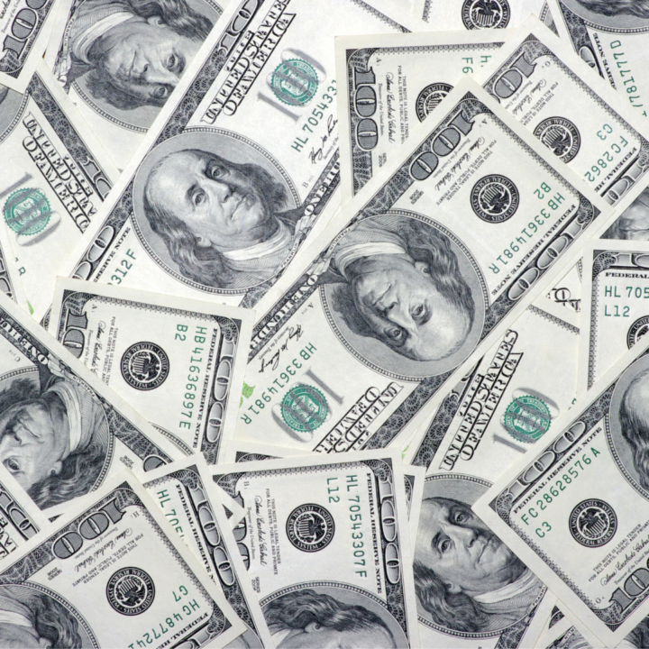 Scattered U.S. $100 bills