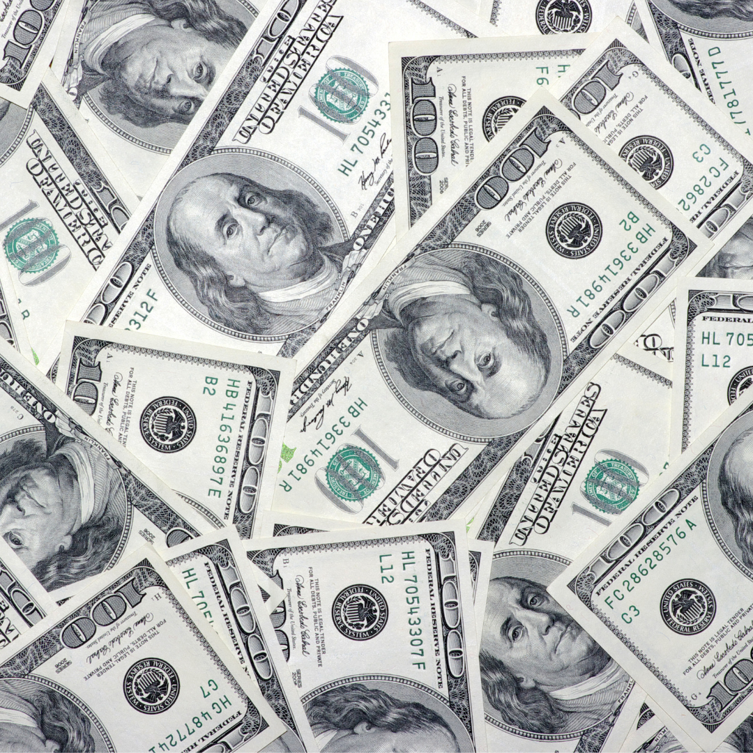 Scattered U.S. $100 bills