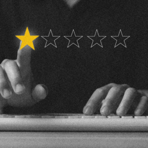 Person at a keyboard selecting a single gold star out of five rating stars on a screen.