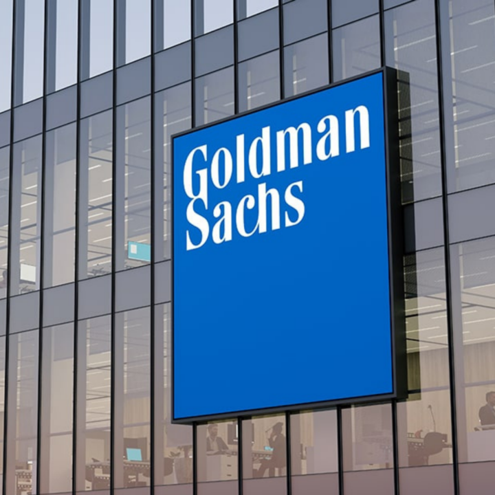 Goldman Sachs logo displayed on the exterior of a modern office building