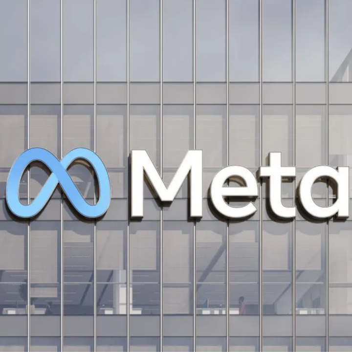 Alt text: Meta logo displayed on the exterior of a modern office building