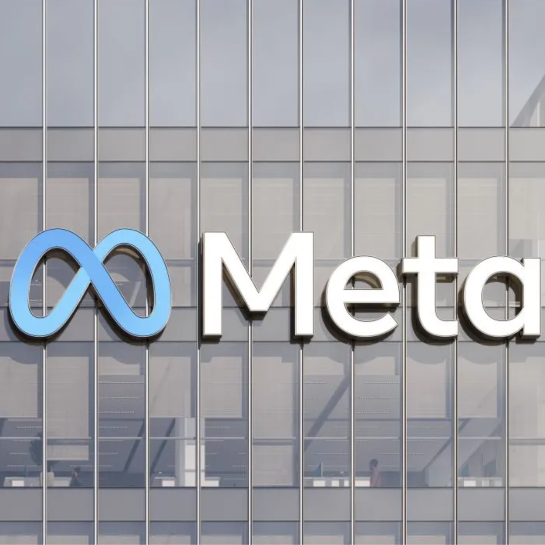 Alt text: Meta logo displayed on the exterior of a modern office building