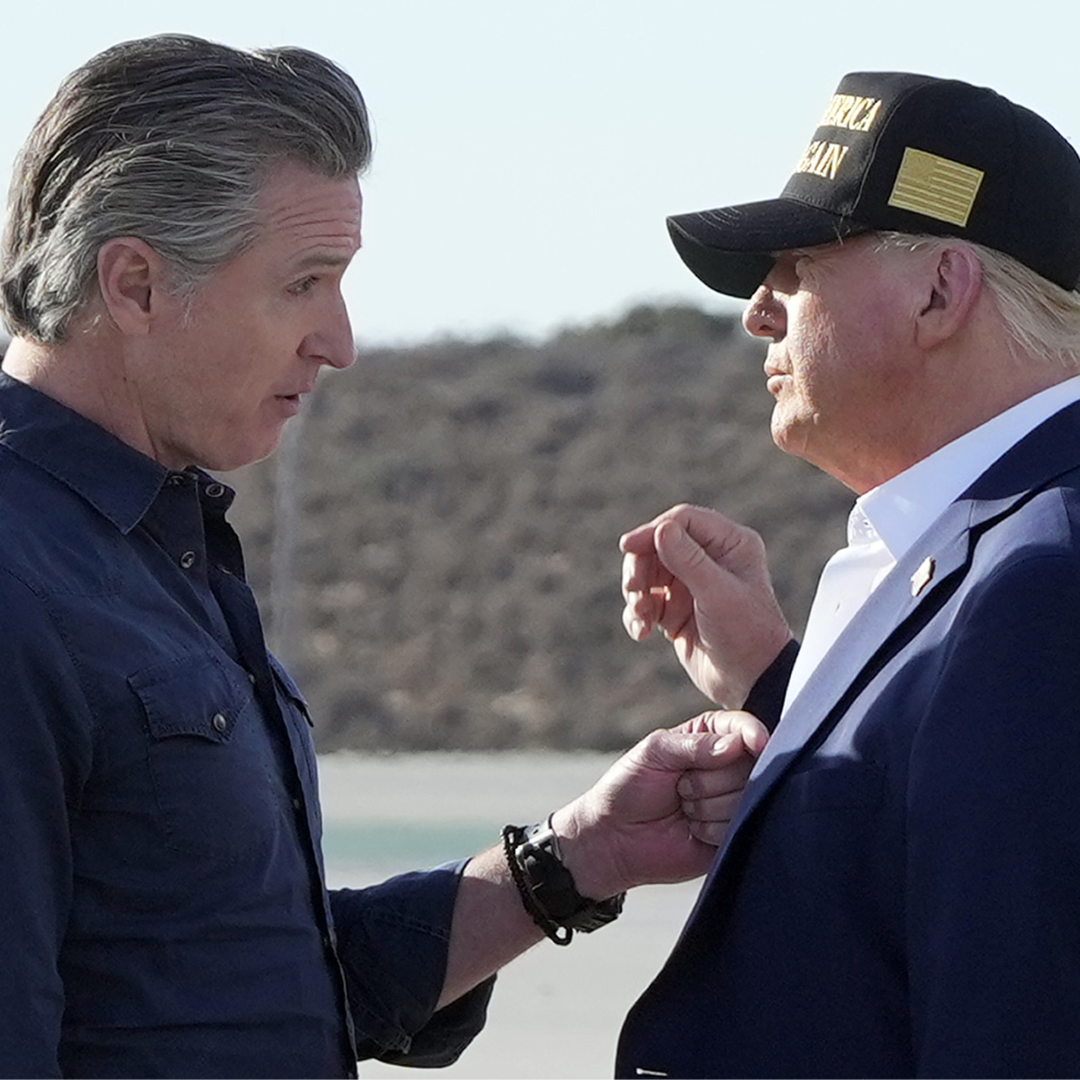 California Governor Gavin Newsom speaking with President Trump outdoors