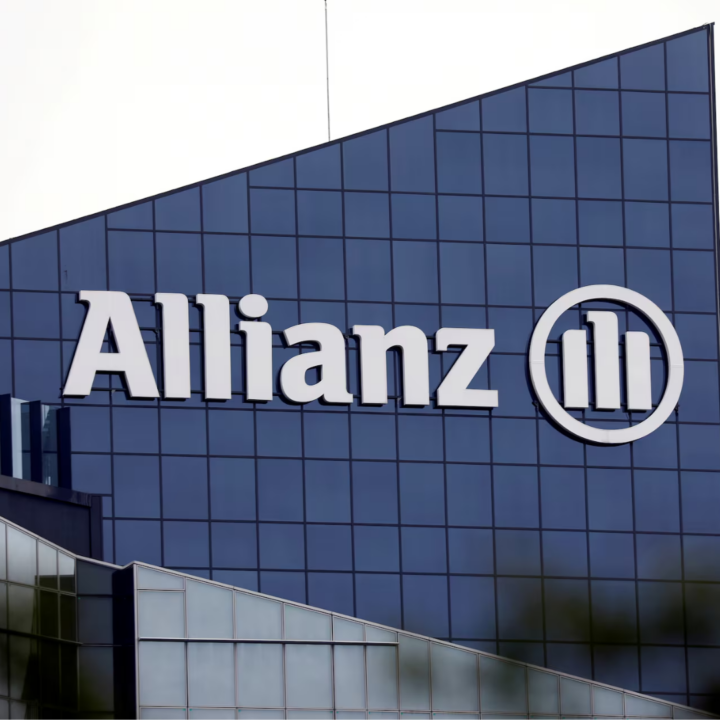 Allianz corporate office building exterior with company name and logo on blue glass facade