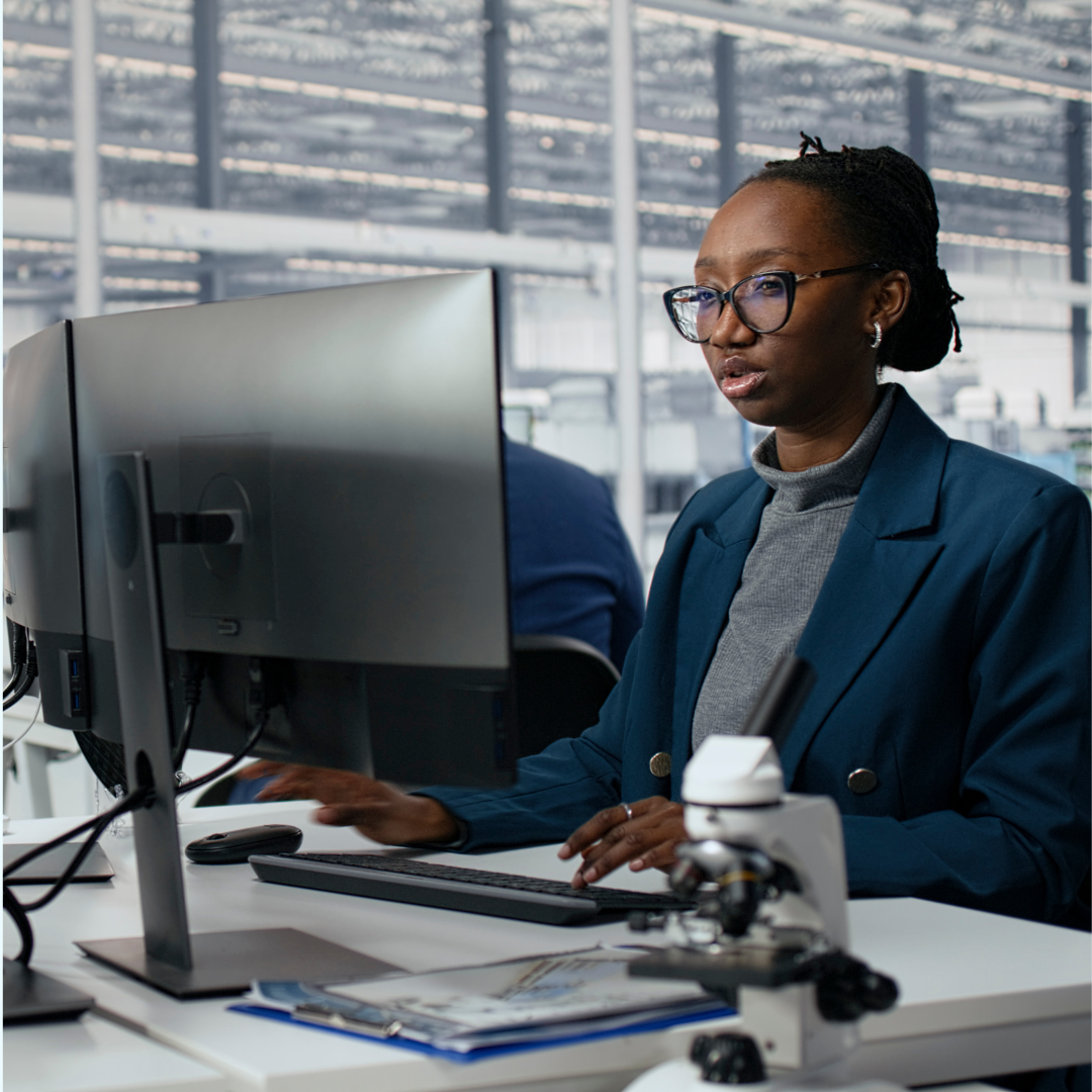 Female employee working at a desktop computer